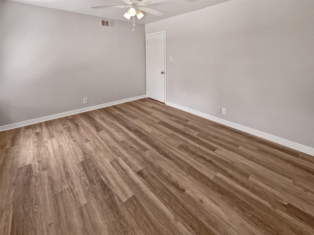 spare room featuring hardwood / wood-style flooring and ceiling fan