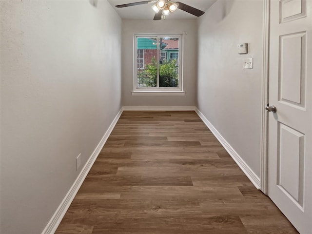 interior space with ceiling fan and dark hardwood / wood-style flooring