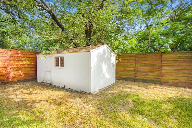 view of shed with a fenced backyard