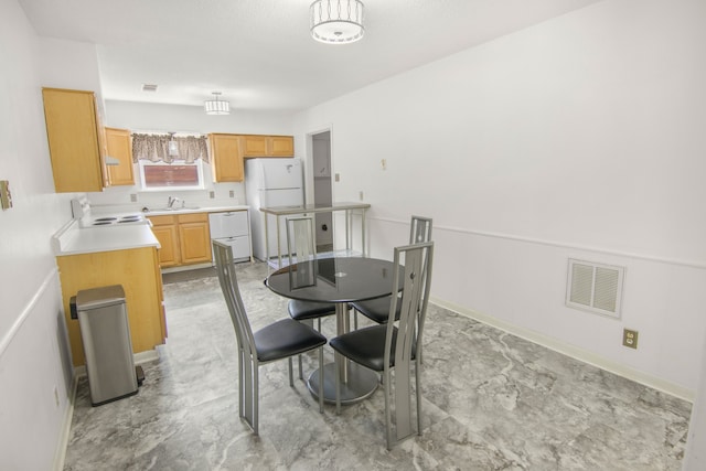 tiled dining space with sink