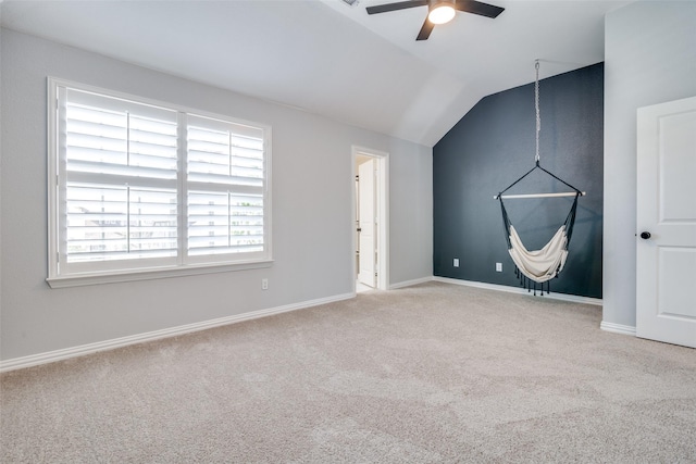 bonus room featuring ceiling fan, light carpet, and vaulted ceiling