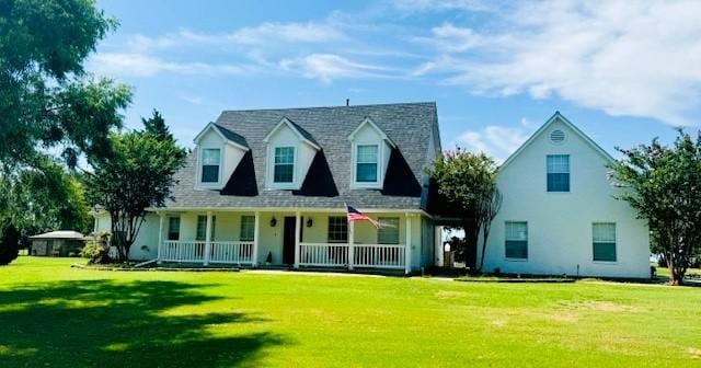 cape cod house with a porch and a front yard