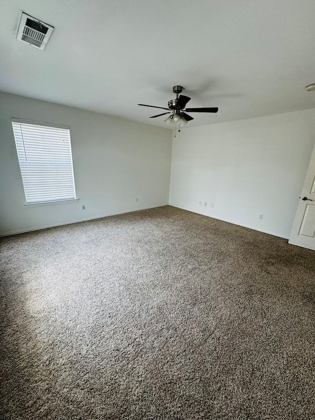 unfurnished room featuring carpet and ceiling fan