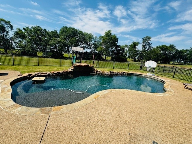 view of swimming pool featuring a lawn and a patio