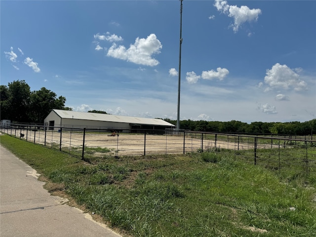 view of yard with a rural view