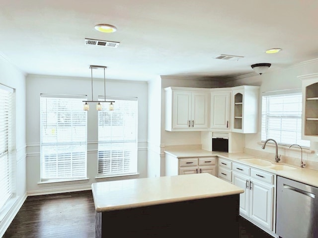 kitchen with dishwasher, an inviting chandelier, white cabinets, sink, and decorative light fixtures