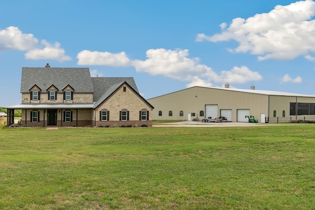 exterior space featuring a garage and a lawn