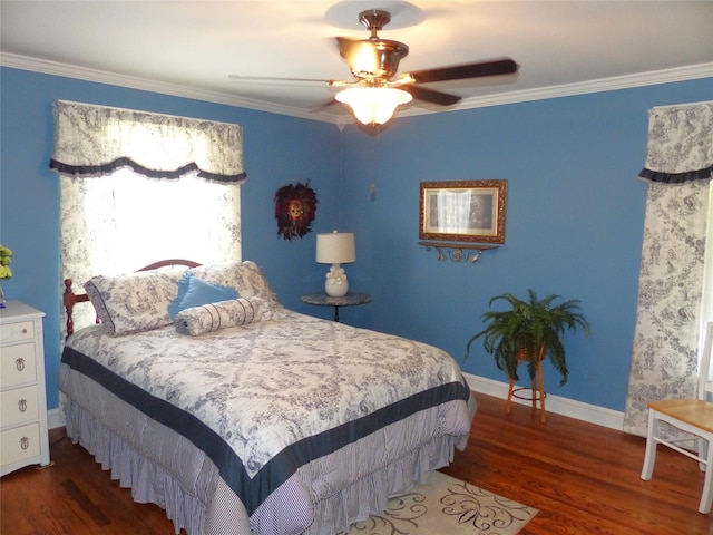 bedroom with ceiling fan, dark hardwood / wood-style flooring, and ornamental molding