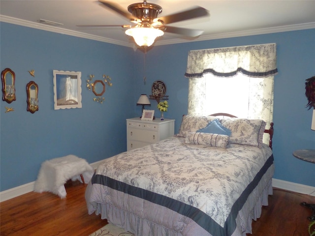 bedroom with ceiling fan, dark wood-type flooring, and ornamental molding