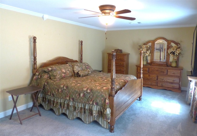 bedroom featuring ceiling fan, carpet floors, and ornamental molding