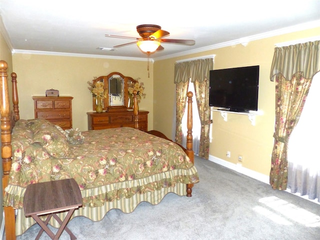 carpeted bedroom featuring ceiling fan and ornamental molding