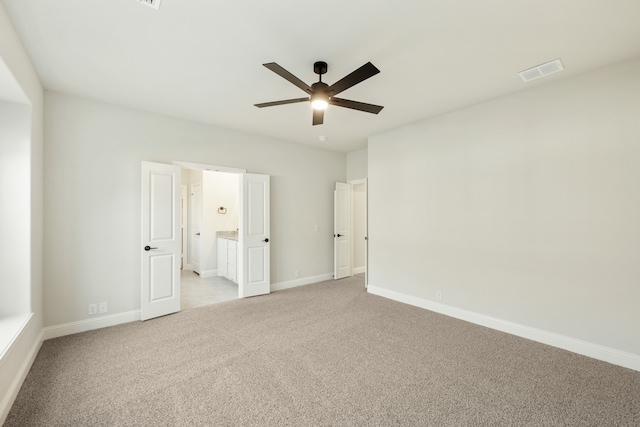 carpeted empty room with ceiling fan