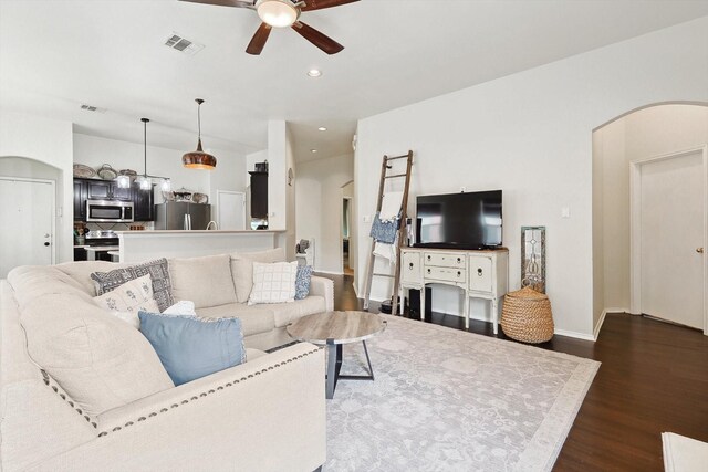 kitchen with appliances with stainless steel finishes, a center island, decorative backsplash, sink, and vaulted ceiling