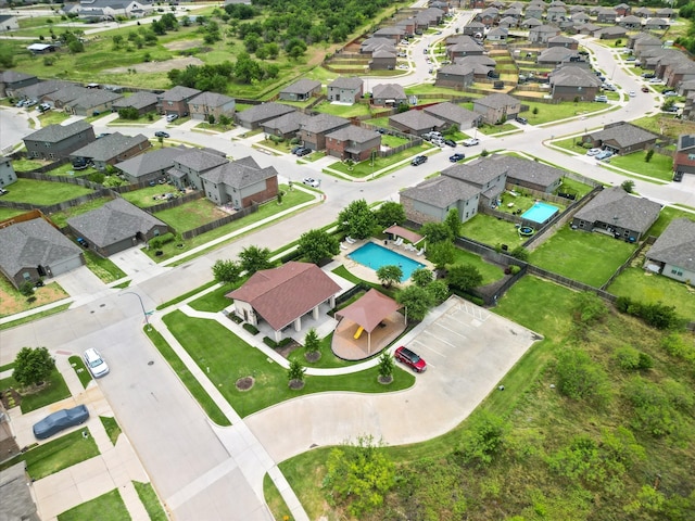 birds eye view of property with a residential view