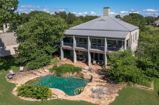 back of property with a patio and a gazebo