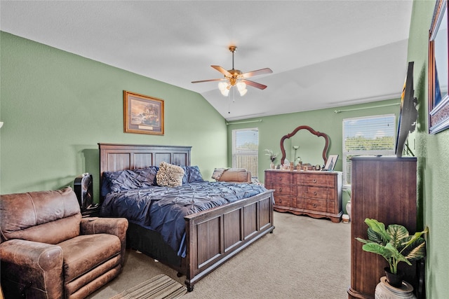 bedroom with light carpet, ceiling fan, and lofted ceiling