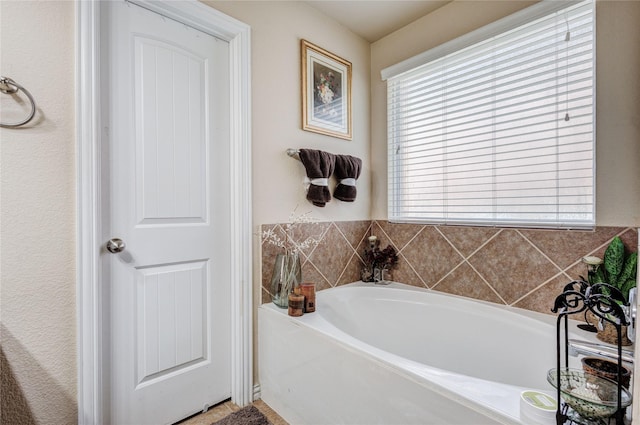 bathroom with a tub to relax in