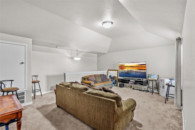 carpeted living room featuring a textured ceiling and vaulted ceiling