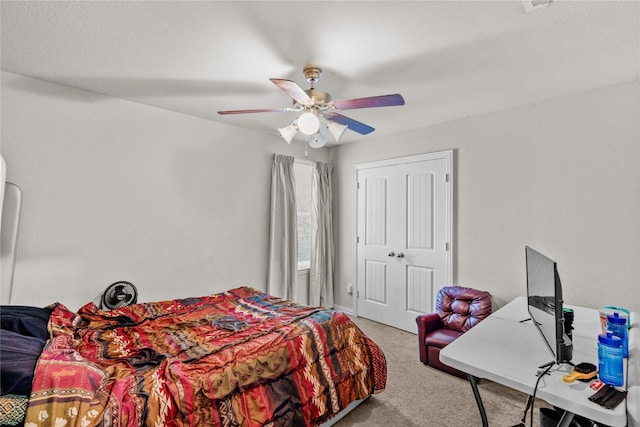 bedroom with light carpet and ceiling fan