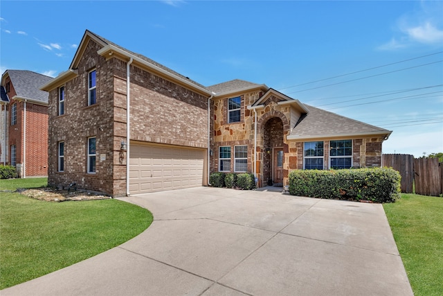 view of front of property featuring a front lawn and a garage