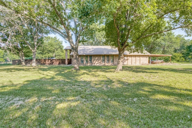 view of yard with a carport