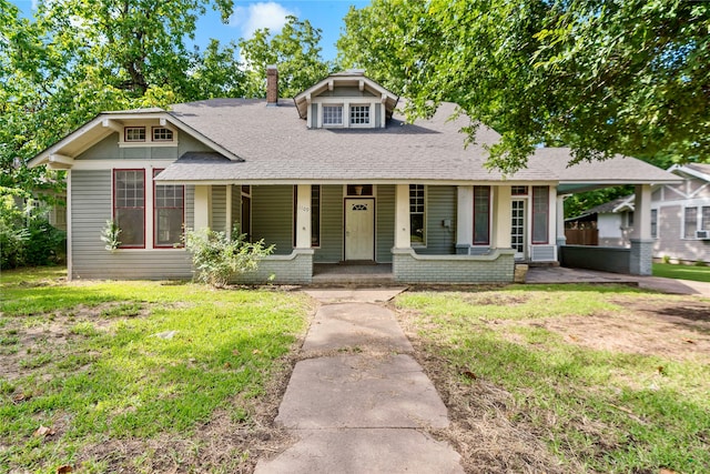 view of front of house featuring a front yard and covered porch