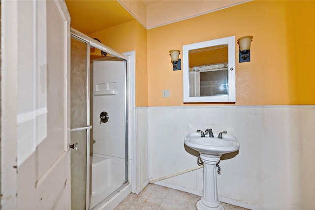 bathroom featuring an enclosed shower and tile patterned flooring