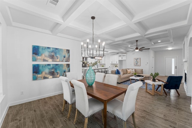 dining space with beam ceiling, coffered ceiling, and ceiling fan with notable chandelier