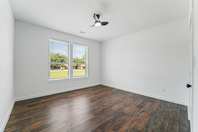 spare room with dark hardwood / wood-style floors