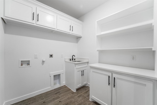 clothes washing area featuring cabinets, hookup for a washing machine, hookup for an electric dryer, sink, and hookup for a gas dryer