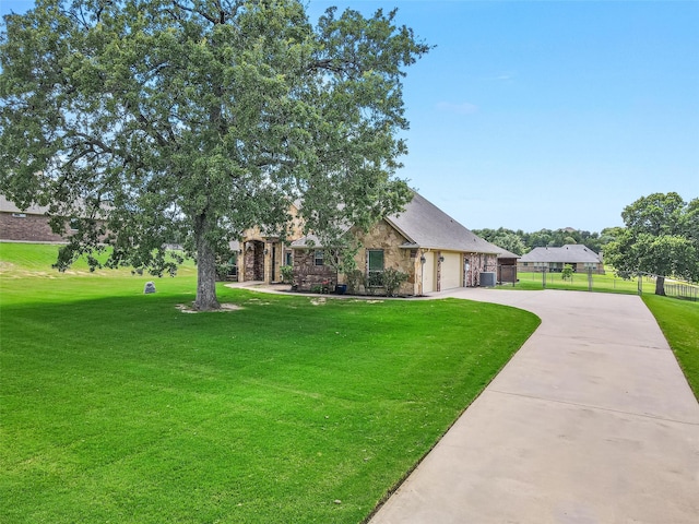 view of front facade with a garage and a front lawn