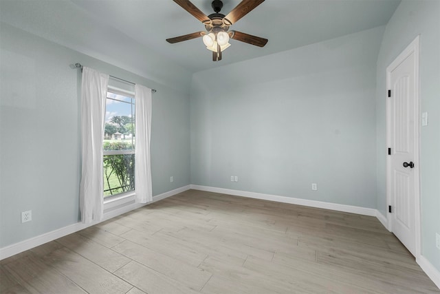 unfurnished room with light hardwood / wood-style flooring, ceiling fan, and a healthy amount of sunlight