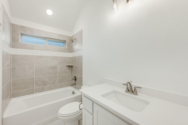 full bathroom with vanity, tiled shower / bath, and toilet