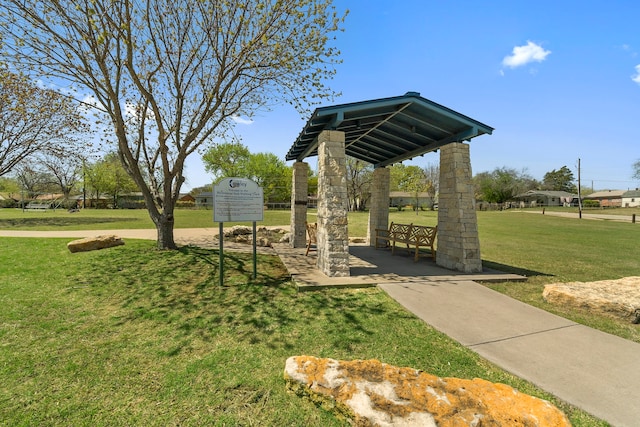 view of home's community featuring a lawn