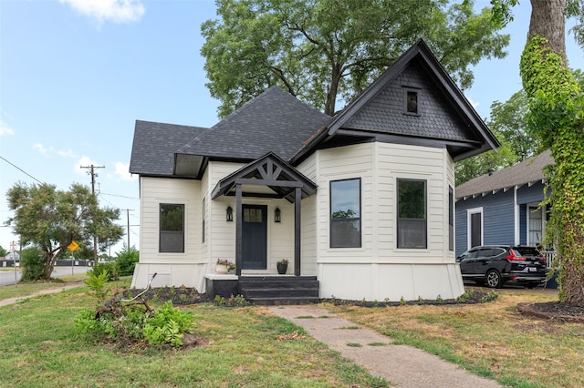 victorian-style house with a front yard