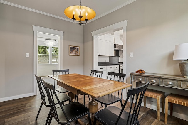 dining area featuring crown molding, dark wood-type flooring, and a chandelier