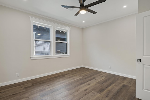 empty room with ceiling fan, dark hardwood / wood-style flooring, and ornamental molding