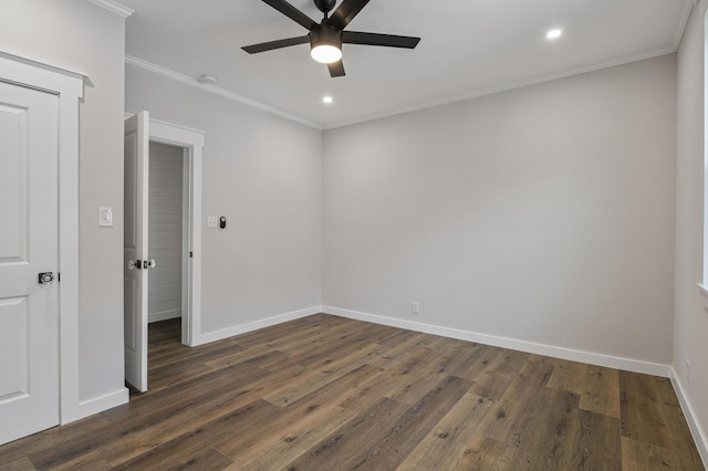 unfurnished room featuring dark hardwood / wood-style flooring, ceiling fan, and ornamental molding