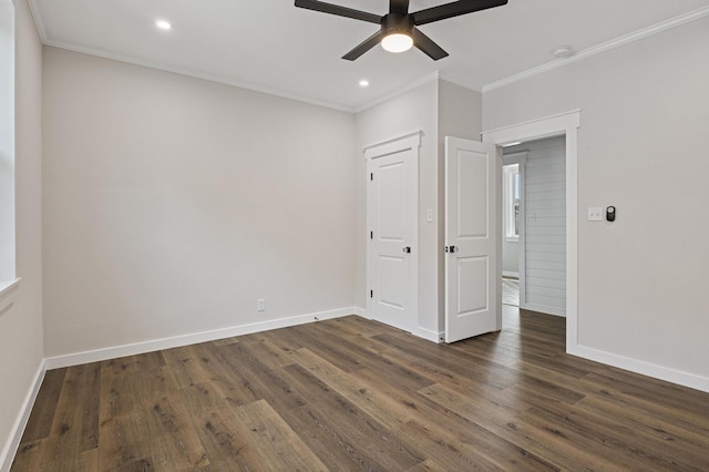 unfurnished bedroom featuring ceiling fan, crown molding, and dark wood-type flooring