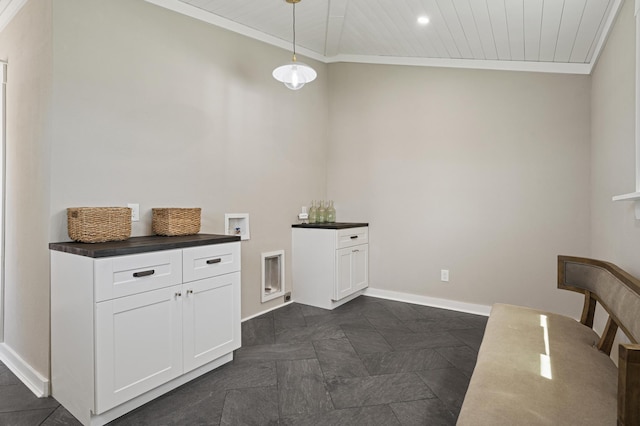 laundry room featuring washer hookup, cabinets, ornamental molding, and wood ceiling