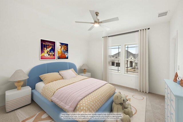 carpeted bedroom with ceiling fan and lofted ceiling