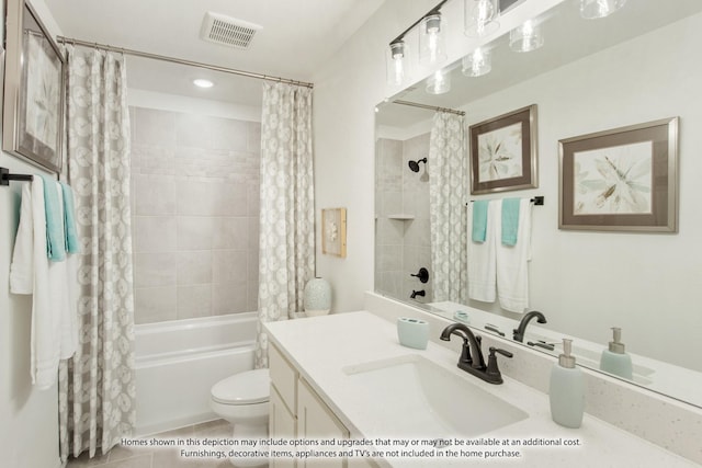 full bathroom featuring tile patterned floors, shower / bath combo with shower curtain, vanity, and toilet