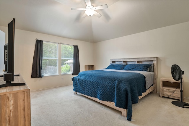 carpeted bedroom featuring ceiling fan and vaulted ceiling