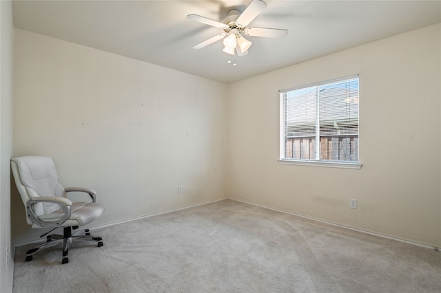 unfurnished room featuring ceiling fan and carpet floors