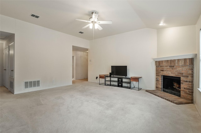 carpeted living room featuring ceiling fan, lofted ceiling, and a brick fireplace