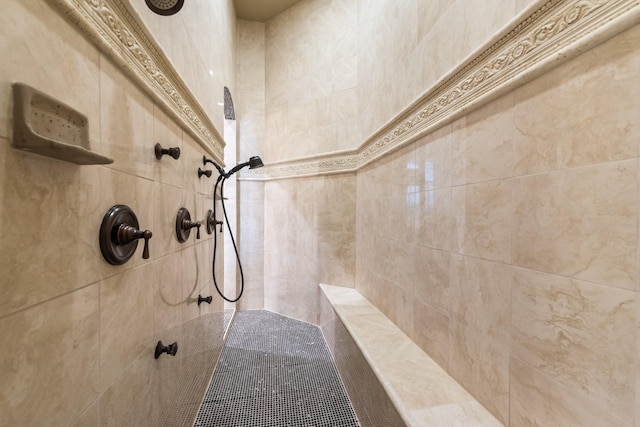 bathroom with tiled shower