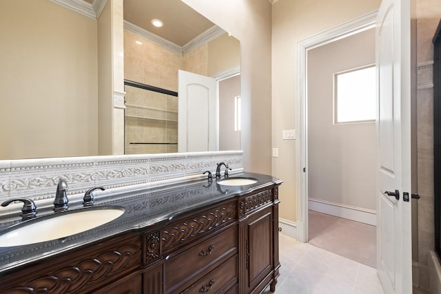 bathroom with vanity, tile patterned flooring, ornamental molding, and a shower