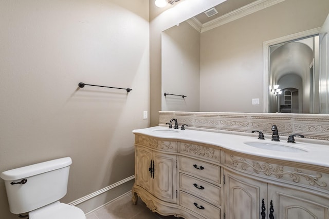 bathroom featuring decorative backsplash, tile patterned flooring, ornamental molding, vanity, and toilet