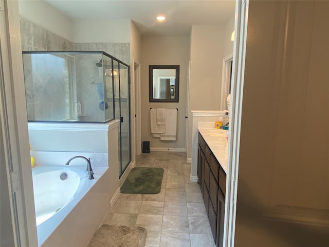 bathroom featuring vanity and plus walk in shower