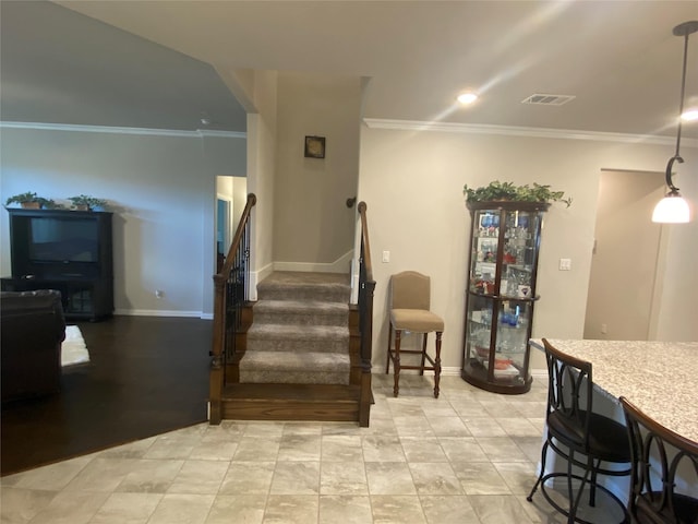 staircase with crown molding